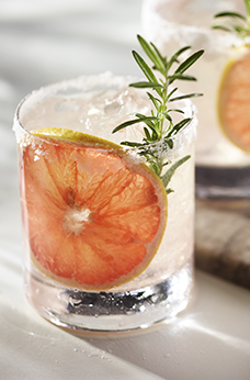 Paloma cocktail in Collins Glass, from tequila with grapefruit juice,  decorated with a slice of grapefruit and rosemary.Whiskey in rocks glass  with i Stock Photo - Alamy